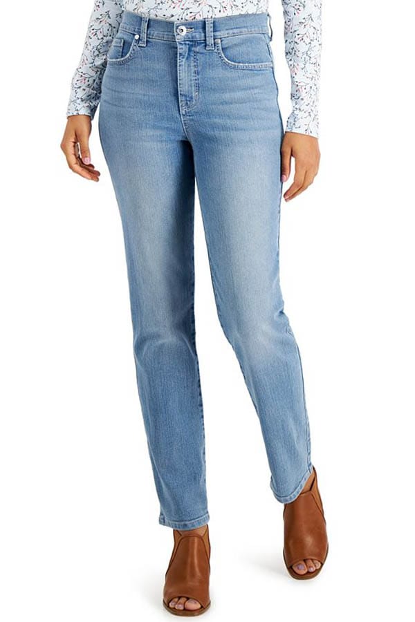 Waist-down view of model wearing mid-blue Style & Co. jeans for petites.