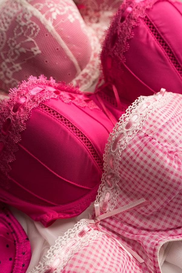 A colorful selection of bras to represent professional bra fitters.