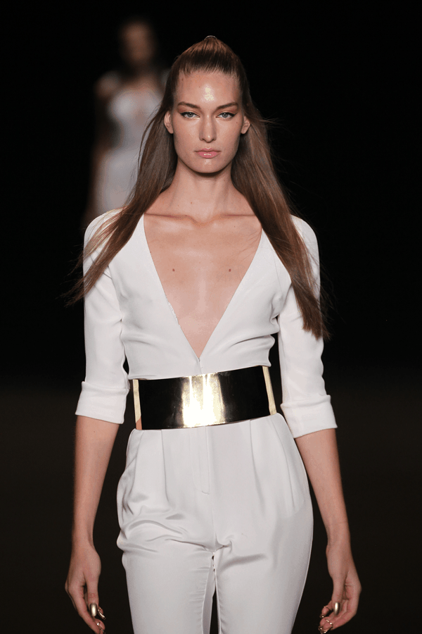 runway model wearing white romper