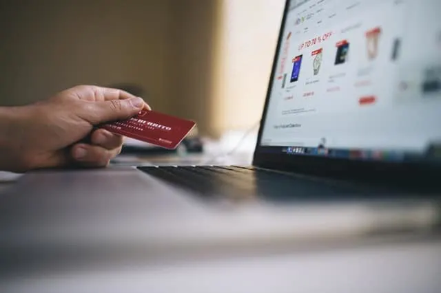 someone shopping online with credit card