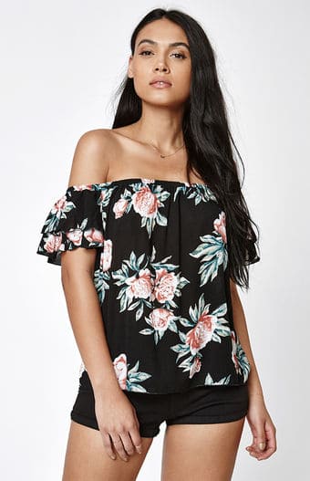 Black off-the-shoulder top with pink and white floral pattern.