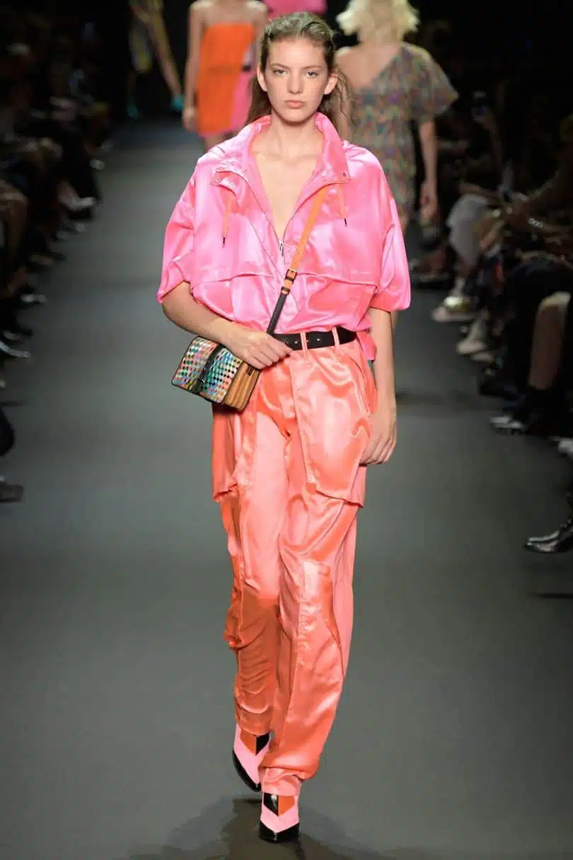 Summer fabrics trends - runway model wearing brightly colored nylon outfit
