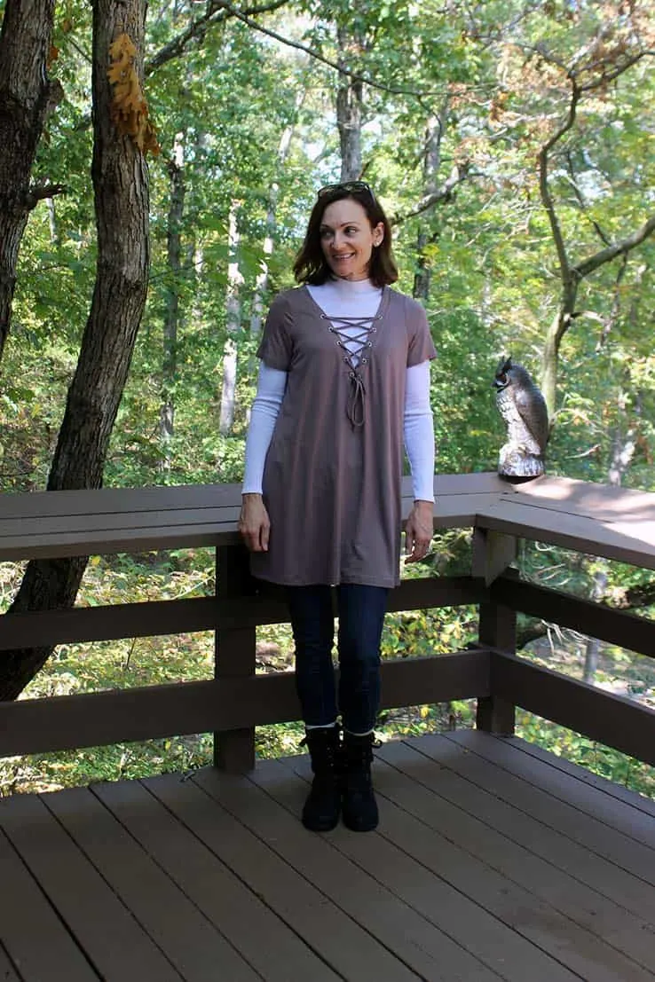 Shift dress worn as a tunic over jeans and a long-sleeved top