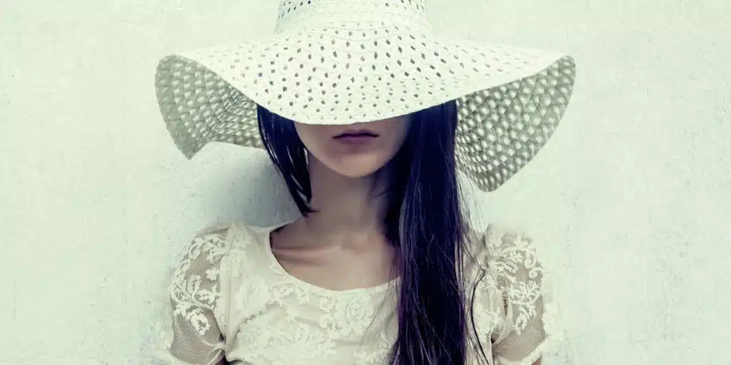 Styling the lace trend — woman wearing lace dress and hat