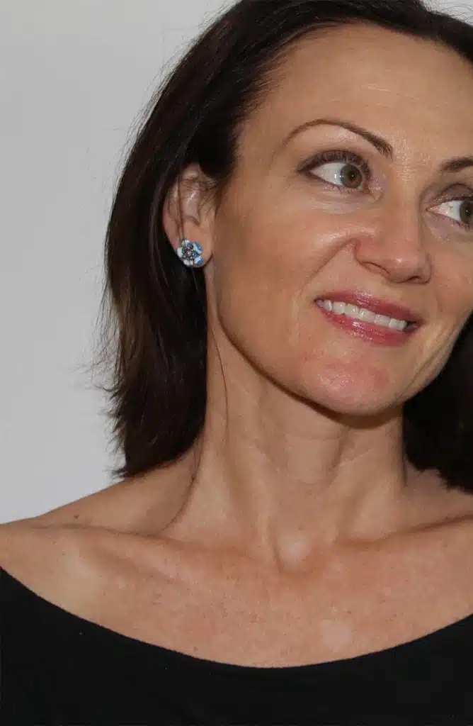 Catherine Brock wearing mid range jewelry line Ana Luisa jewelry