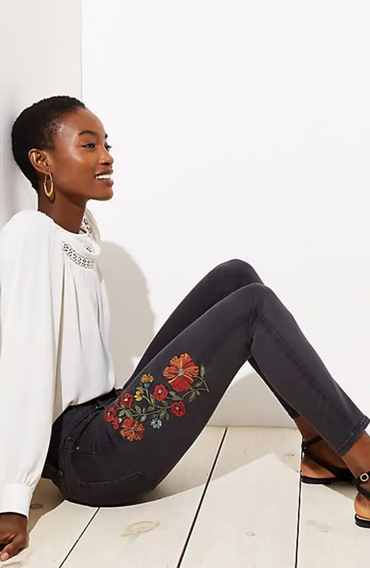 Black skinny jeans with floral embroidery