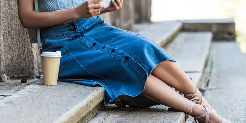 Long denim skirt outfit with strappy sandals and tank top