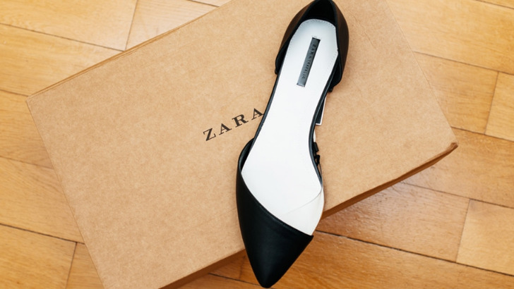 Pointed toe shoe sitting atop a Zara box.