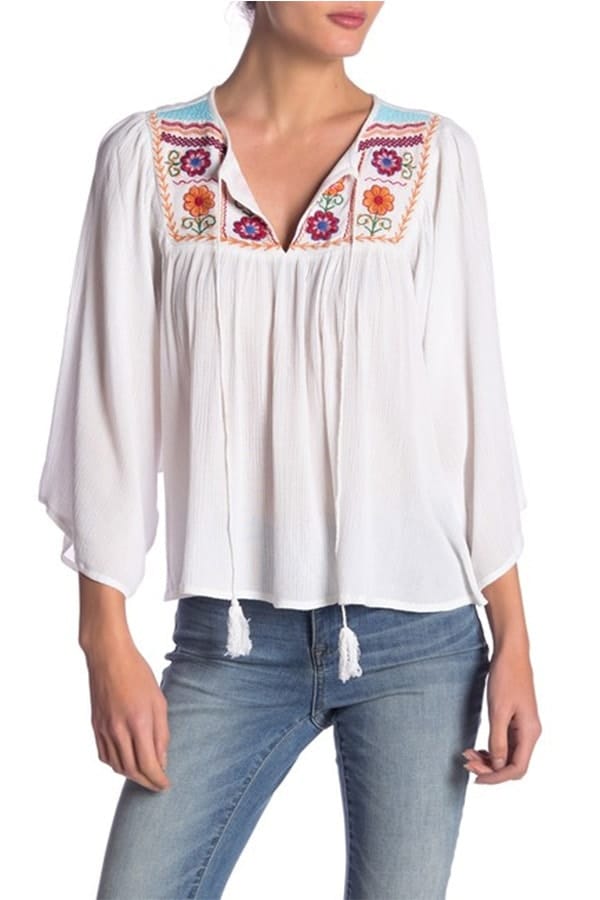 White peasant top with floral detail