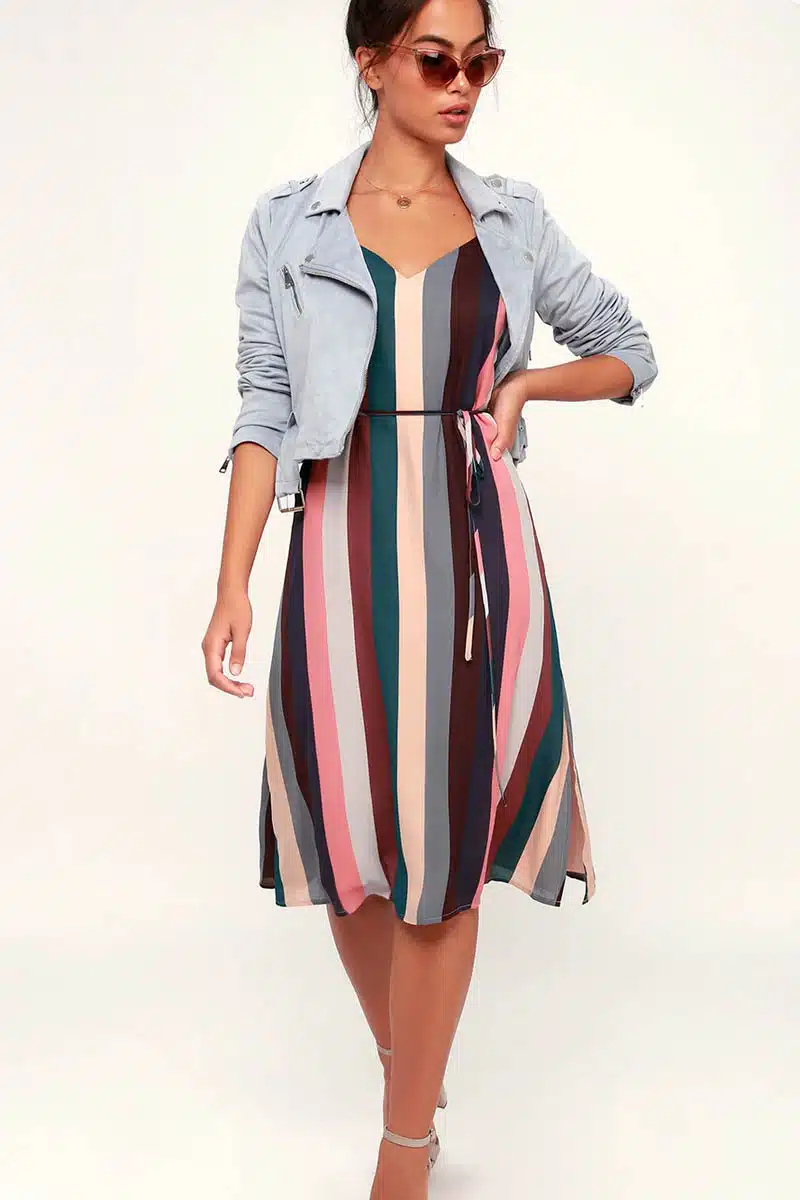 Model wears striped, belted slip dress from Lulu's.