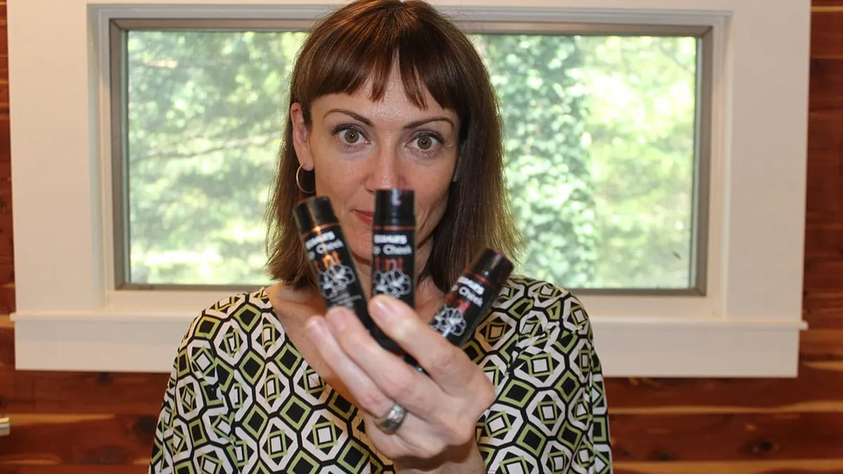 Catherine Brock holding EcoLips lip and cheek tint