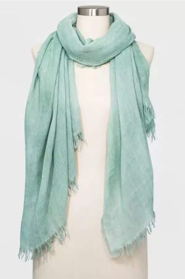 Green scarf with frayed edges