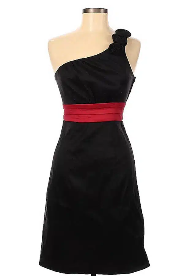 Black dress with one-shoulder strap and red belt.