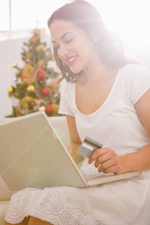 Brunette looking up the value of her gift card online. 