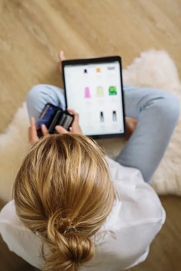 Woman shopping Amazon Prime Day at home on tablet.
