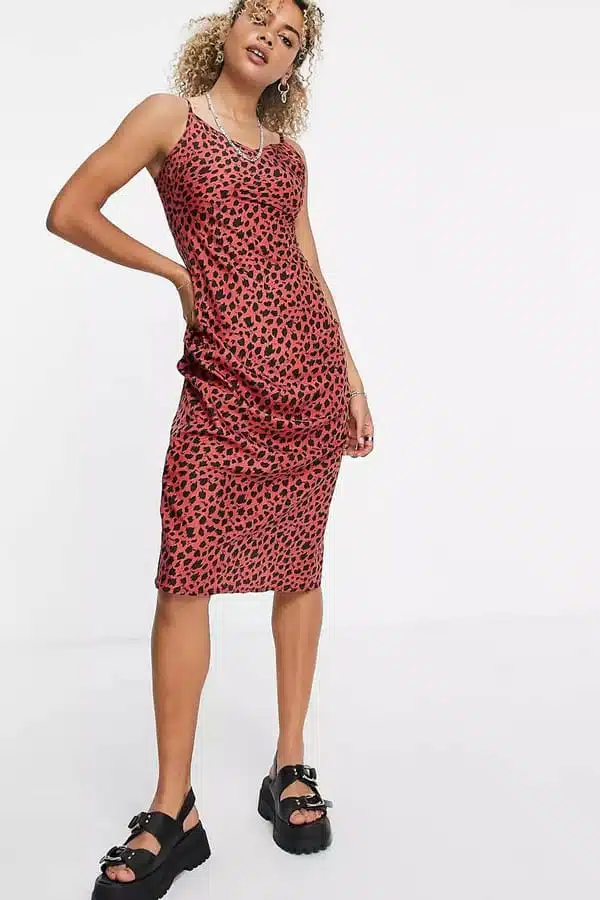 Model wearing pink leopard-print shirt dress.