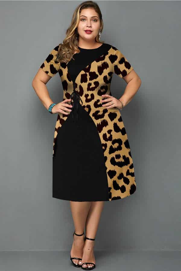Model wearing midi A-line dress with leopard-print detail.