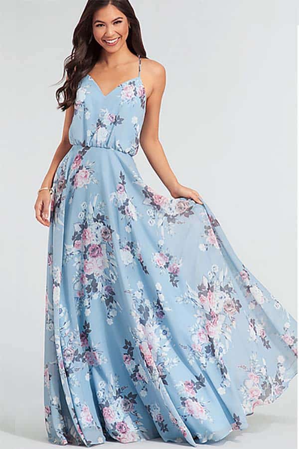 Model wearing pale blue floral, floor-length dress.