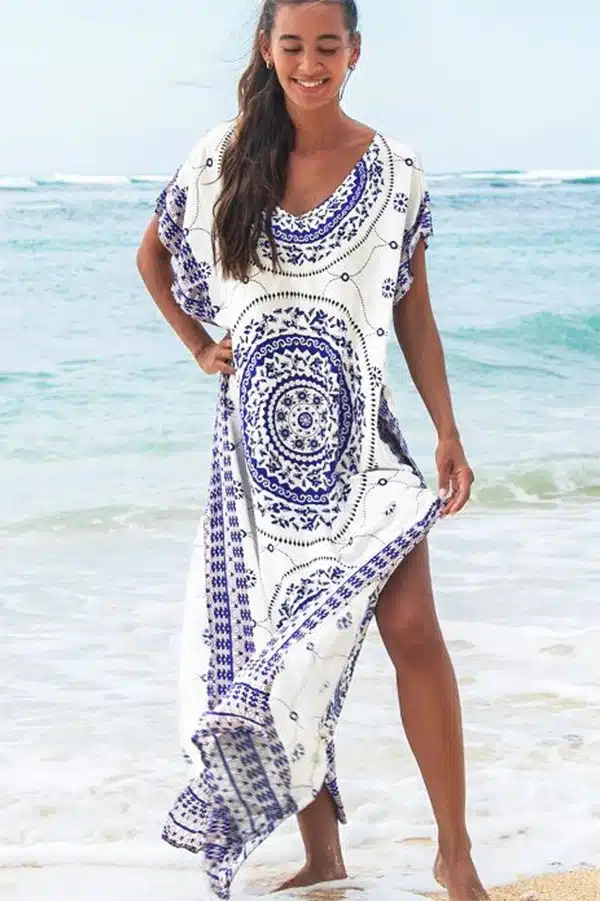 Model wearing caftan as cover up beach dress.