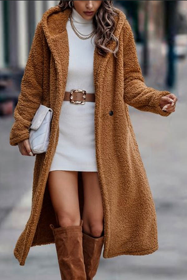Model wears camel trench coat from Zulily.