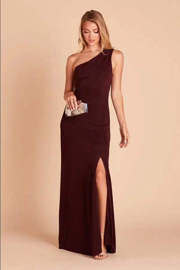 Model wears one-shoulder party gown.