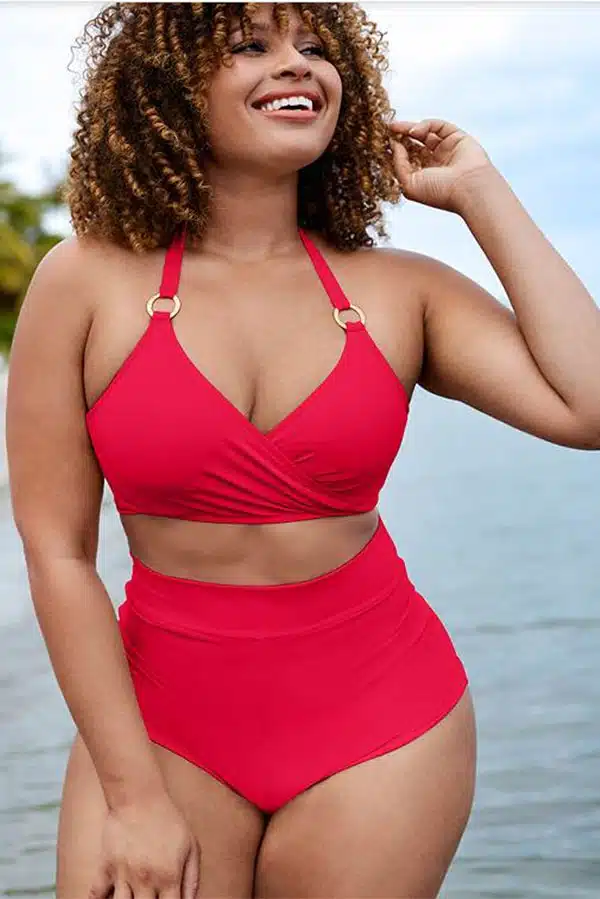Model wears high-waisted swim suit with halter top, suitable for women with long torsos.