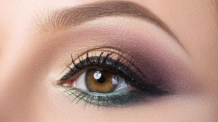 Close up of woman's eye with cat eye makeup.