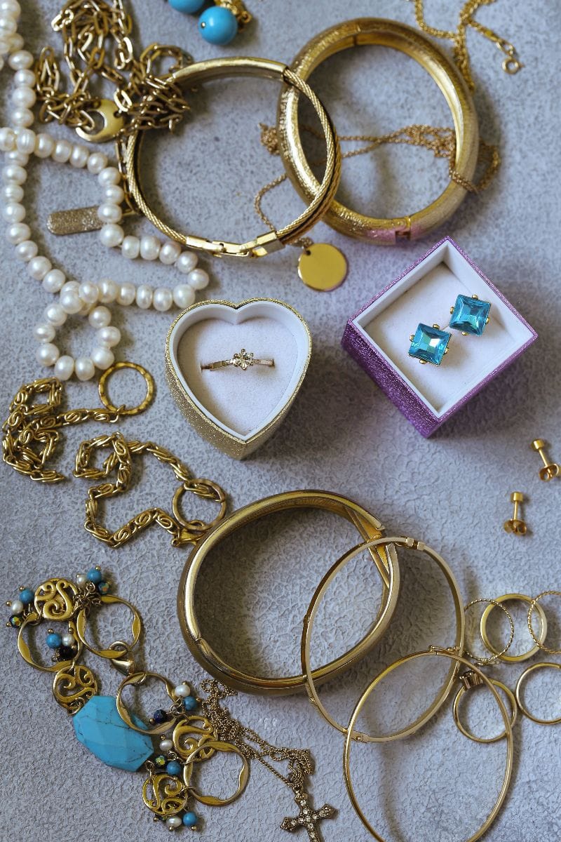 Collection of vintage jewelry in display at thrift store.