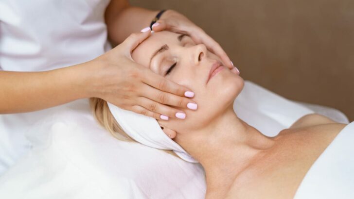 Woman gets facial massage.